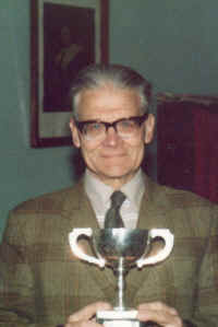 Dad_with_Bishop_Fisher's_Cup_-_won_in_1931_&_1932.jpg (118523 bytes)